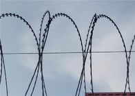 La recinzione del cavo a spirale del rasoio di uso per la sicurezza residente alloggia il coltello che rade la maglia